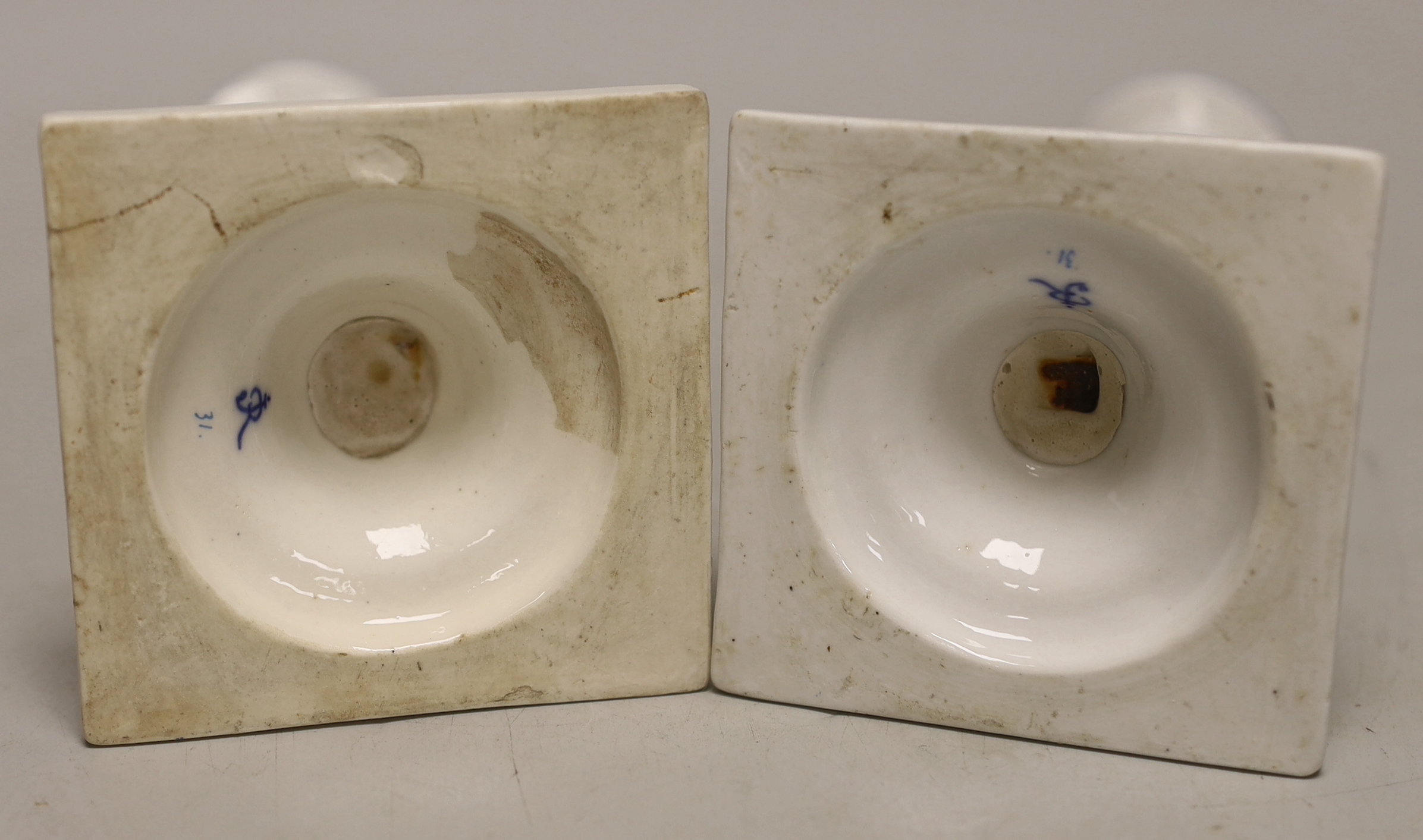 A pair of German porcelain candlesticks, marked JR, with applied floral decoration, 18cm